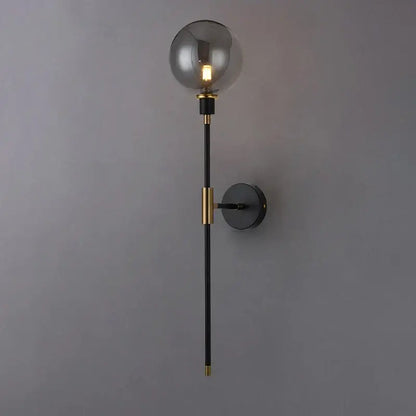 Modern black and gold glass ball wall lamp with a spherical smoked glass shade for stylish living room decorbites wall lamp