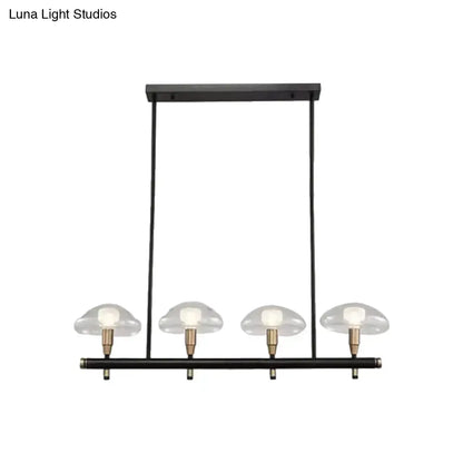DecorBites black metal pendant light with four clear mushroom glass shades and brass accents ideal for restaurants