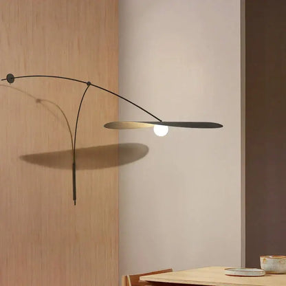 Modern black metal led wall lamp with sleek curved arm and glass shade for elegant bedroom lighting