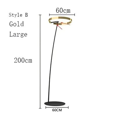 Modern black and gold led floor lamp with a sleek curved gold-finished stem and circular head for living room lighting