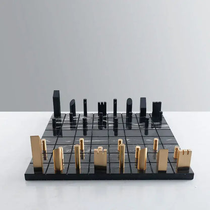 Modern black and gold metal marble chessboard with sleek minimalist pieces for living room decorbites golden metal style