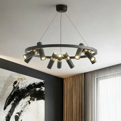 Modern black and gold ring led pendant light featuring a circular black ring led with gold-accented cylindrical lights