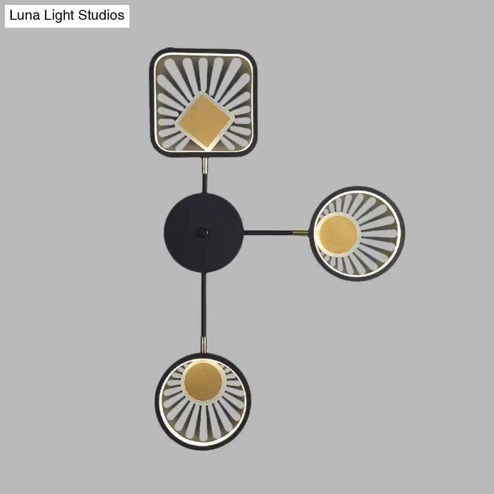 Modern black and gold sunburst led wall sconce with geometric inches fixture featuring circular and square illuminated panels