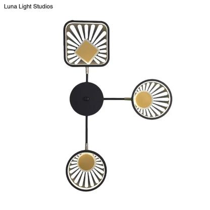 Modern black and gold sunburst led wall sconce with geometric design and three radiating light fixtures 18 inches fixture