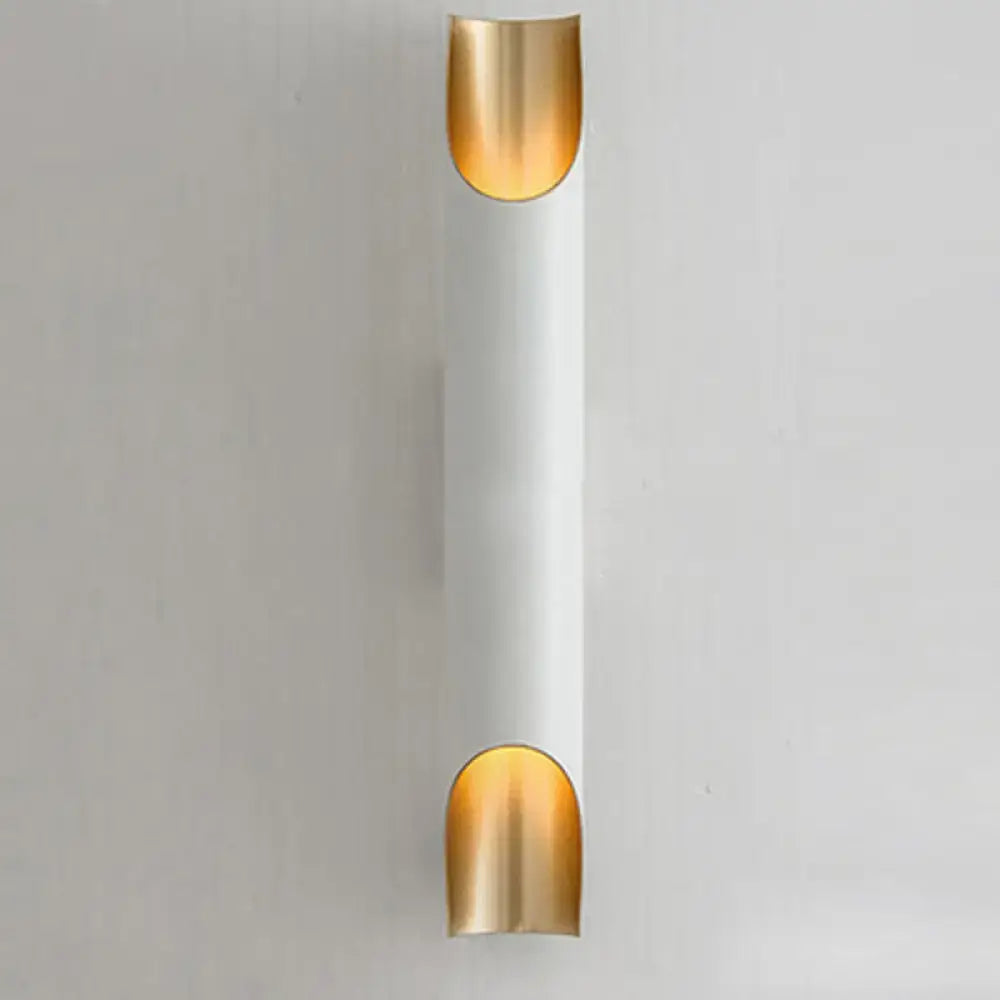 Modern black and gold tubular aluminum wall sconce with white cylindrical body for living room lighting