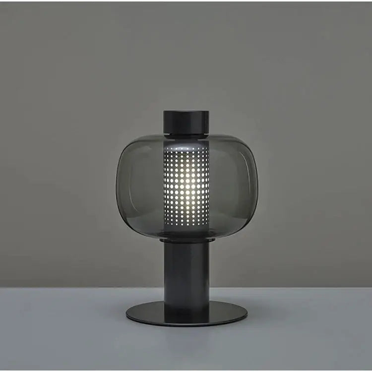 Modern black and gray decorbites glass table light with perforated smoked glass shade for bedside use