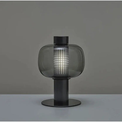 Modern black and gray decorbites glass table light with perforated smoked glass shade for bedside use