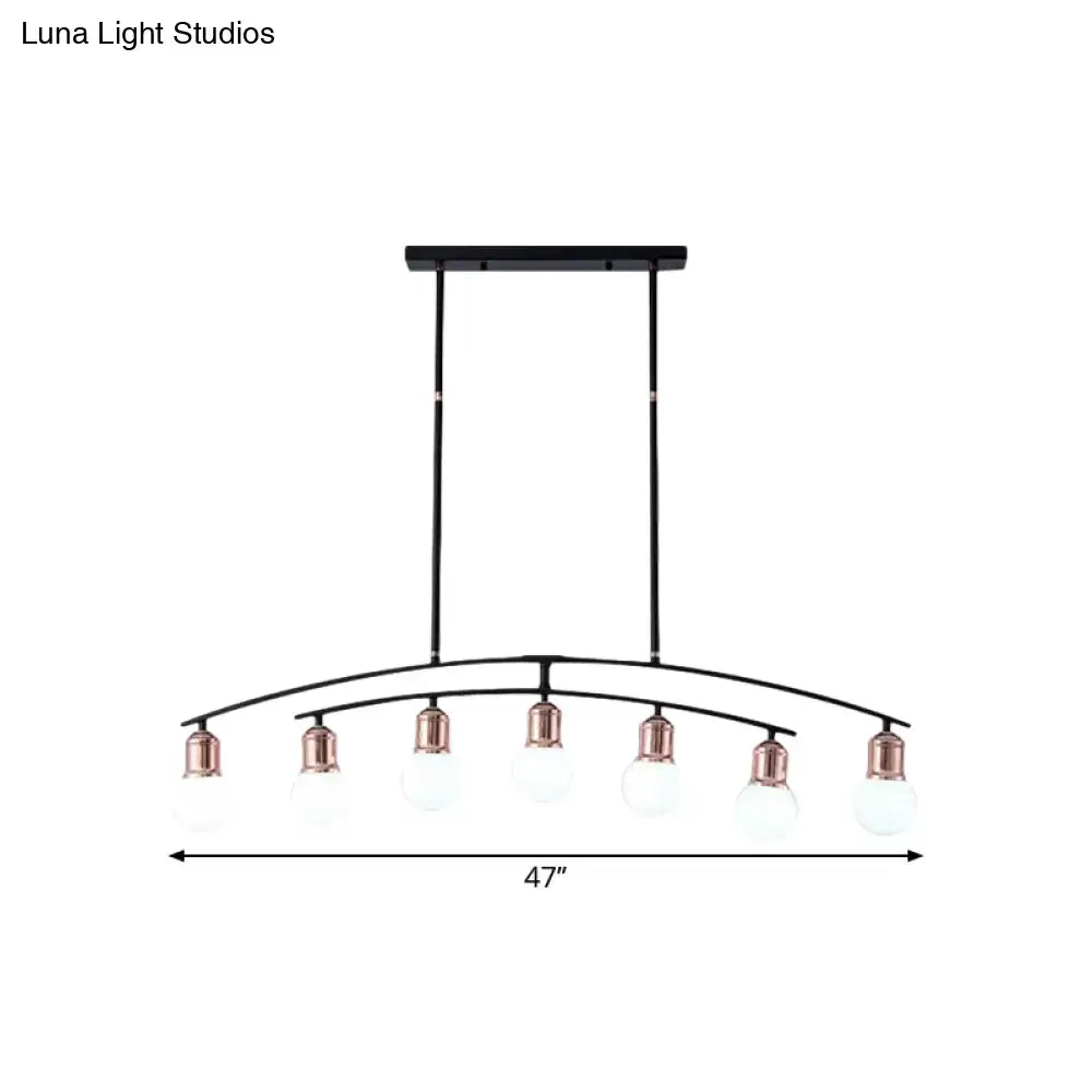 Black metal linear chandelier with six clear glass bulbs and rose gold accents for finish island light decorbites