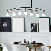 Modern black metal linear chandelier with six rose gold bulb fixtures and black white finish island light design