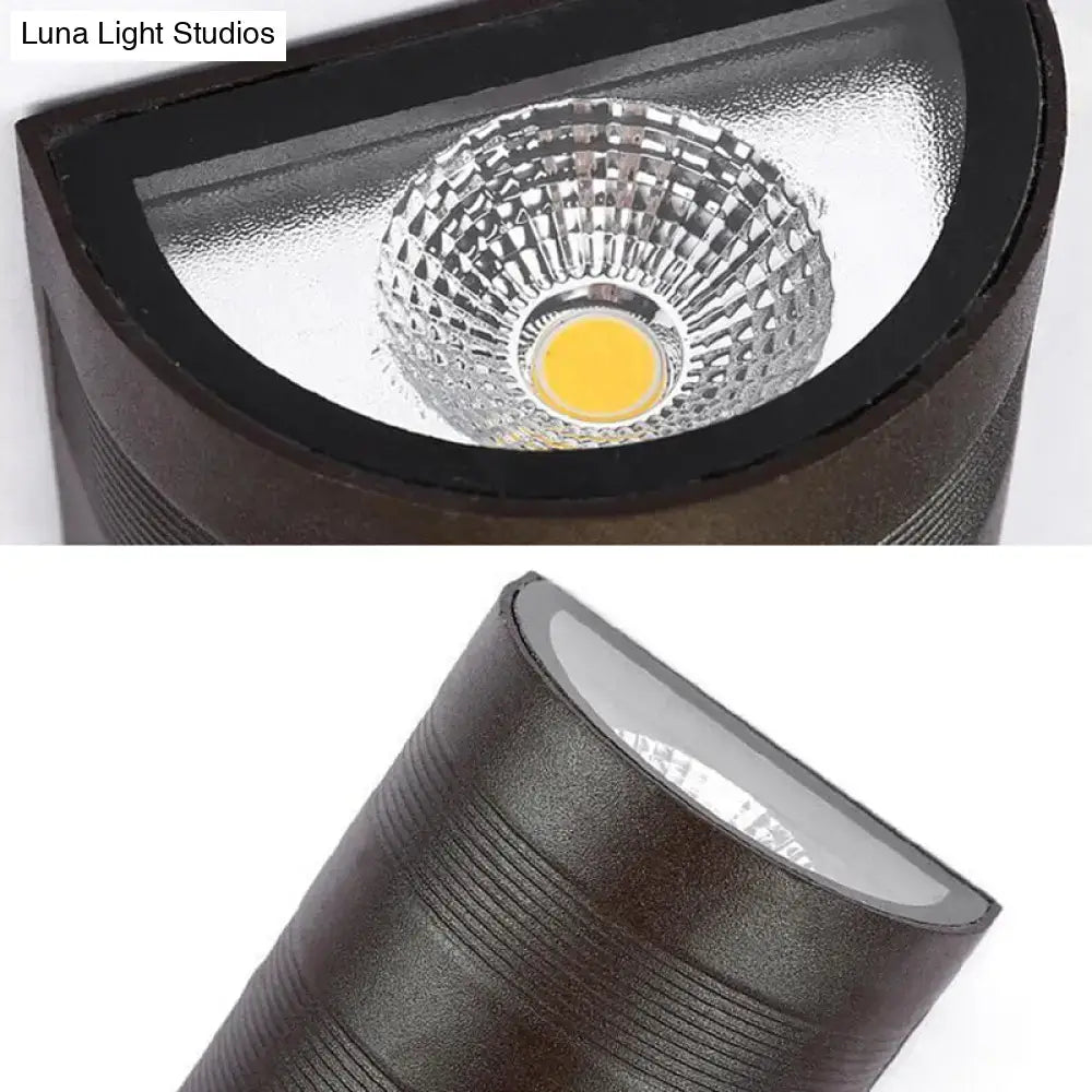 Modern black and silver outdoor wall lamp with textured finish and warm white led bulb for outdoor lighting