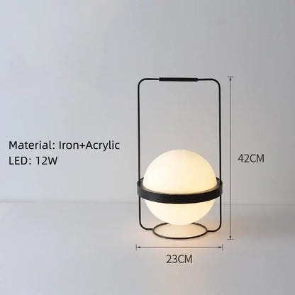 Modern black iron and white acrylic ball wall light with glowing spherical bulb for bedroom sconces lighting