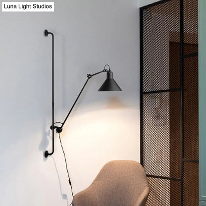 Black industrial-style direct wired electric wall-mounted lamp with articulated arm and conical shade for bedroom use