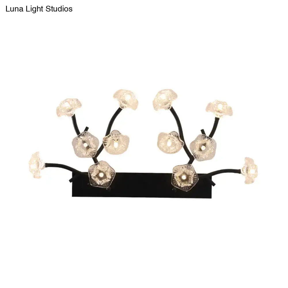 Modern black metal wall light with blossom clear glass flower fixtures for bedroom decor