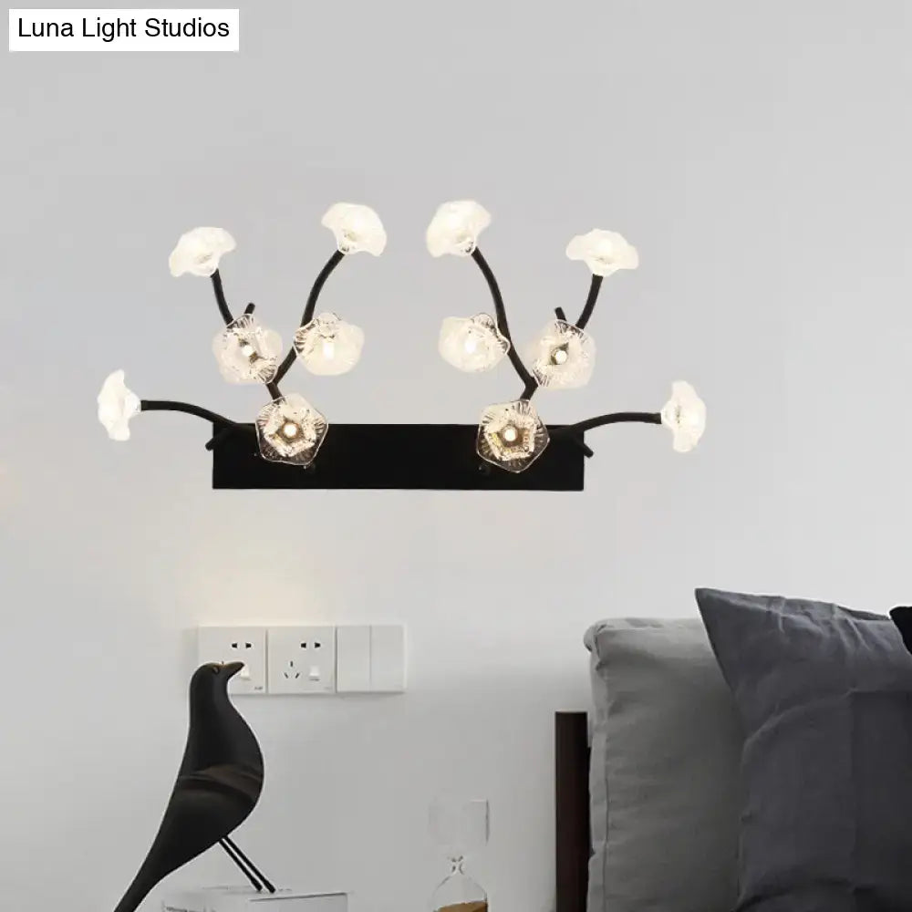 Modern black wall light with blossom clear glass flower shades in wrought iron for bedroom use