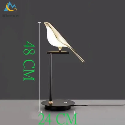 Modern black and white crow led floor lamp featuring a sleek gold bird shape with white translucent body on black stand decorbites crow led