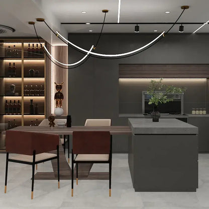 Modern minimalist kitchen island with gray countertop and integrated sink under decorbites designer arc line chandelier