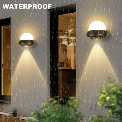 Modern black and white dome led wall lamp with sleek metal base and translucent diffuser for bedroom and garden use