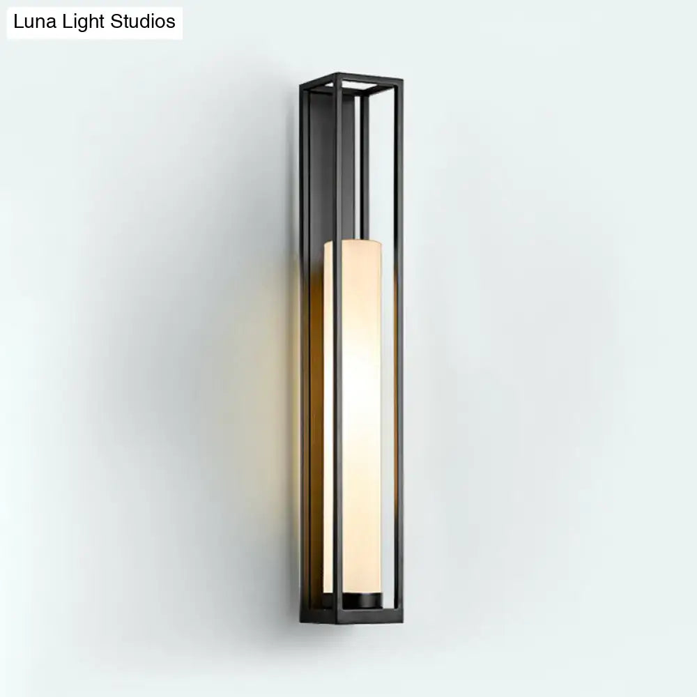 Modern black metal-framed tubular wall mount with warm white glass tubular frosted panel bedroom sconce
