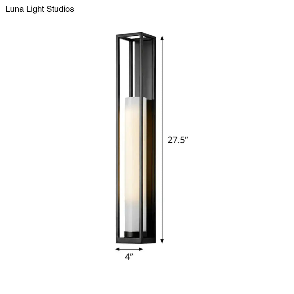 Modern black and white glass tubular wall mount light with black frame and illuminated frosted glass tubular panel