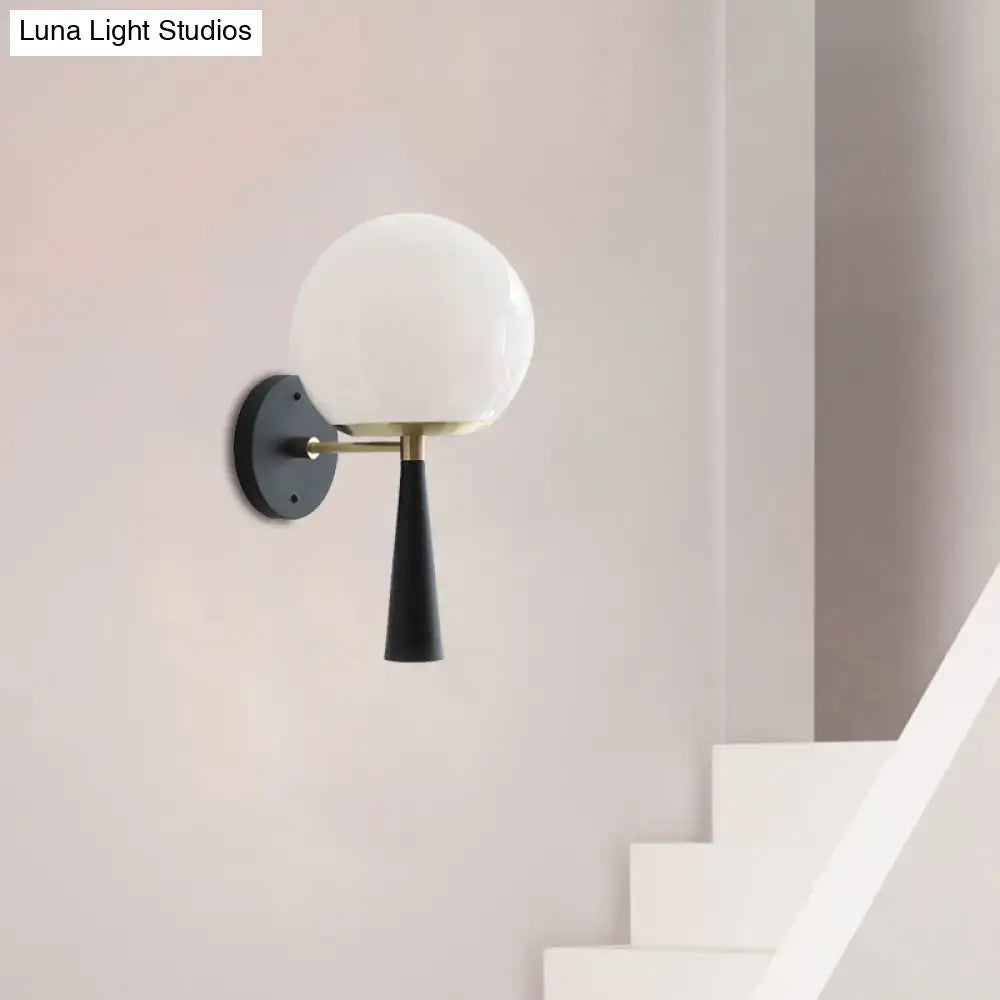 Modern black and white glass wall sconce light fixture with frosted white glass globe and brass hardware for 220v-240v use