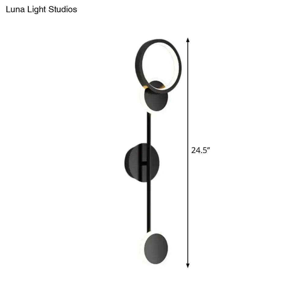 Modern black and white metallic round led wall sconce with circular fixtures and sleek vertical rod for living room lighting