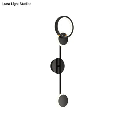 Modern black and white metallic round led wall sconce with circular fixtures and sleek vertical rod for living room lighting
