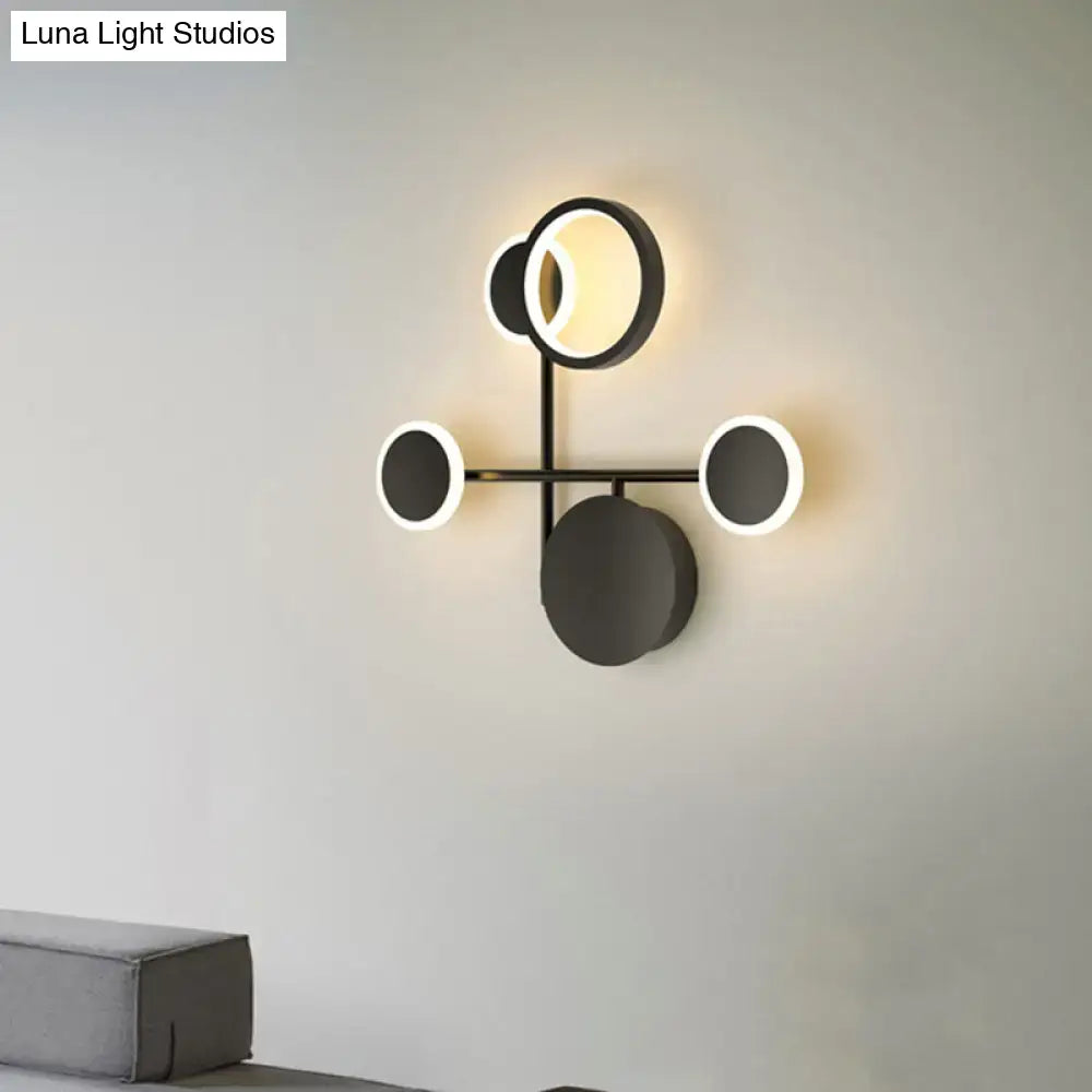 Modern black and white metallic round led wall sconce with four circular led lights for living room lighting