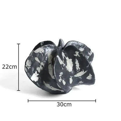 Modern black and white ceramic black starfruit coral sculpture with textured abstract leaf form for bedroom decor