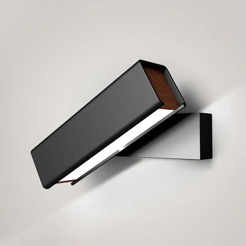 Modern black and wood rotatable led sconce lamp with matte finish and warm wood accent for bedroom lighting