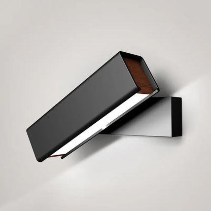 Modern black and wood rotatable led sconce lamp with matte finish and warm wood accent for bedroom lighting