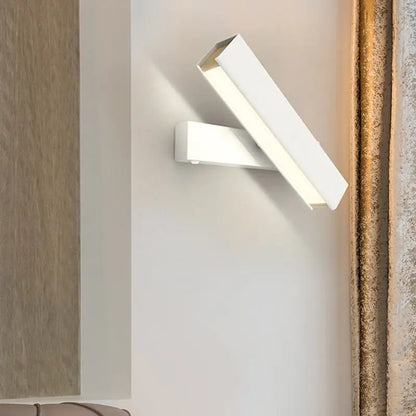 Modern white rectangular led sconce lamp with sleek minimalist design for bedroom featuring rotatable black and wood elements