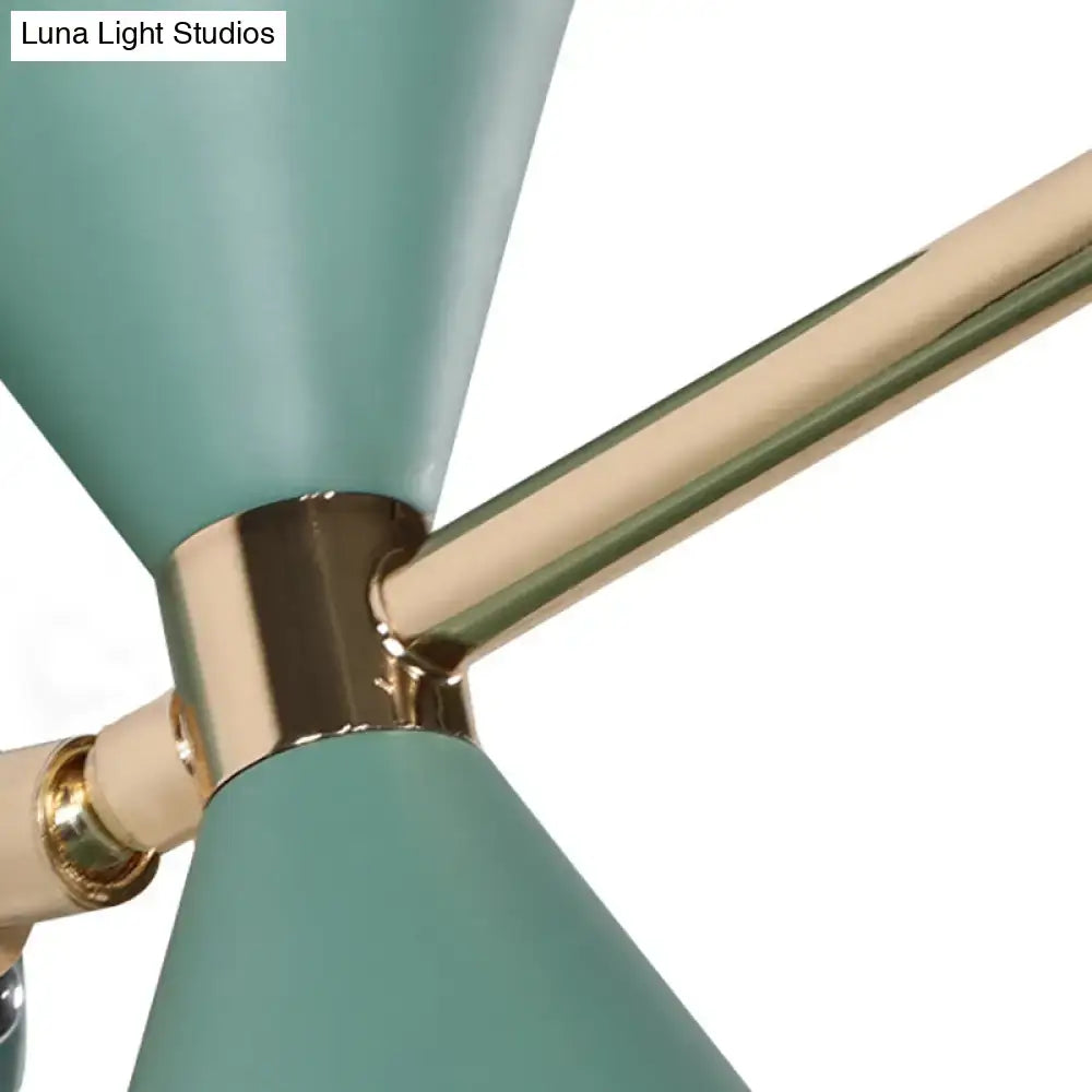 Modern black angle shade wall sconce with teal conical lamp shades and brass accents for bedroom lighting