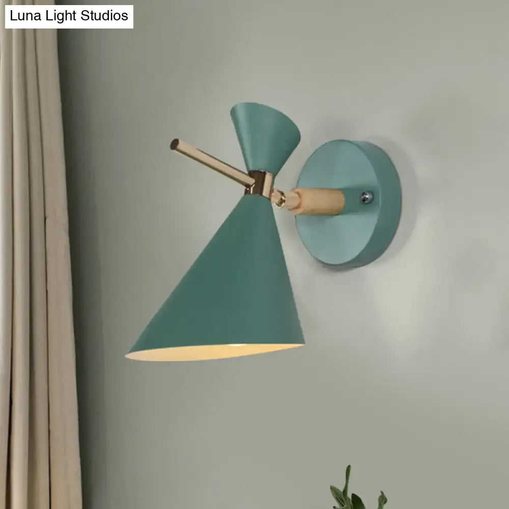 Teal wall sconce with conical angle shade and wooden accents for modern bedroom lighting
