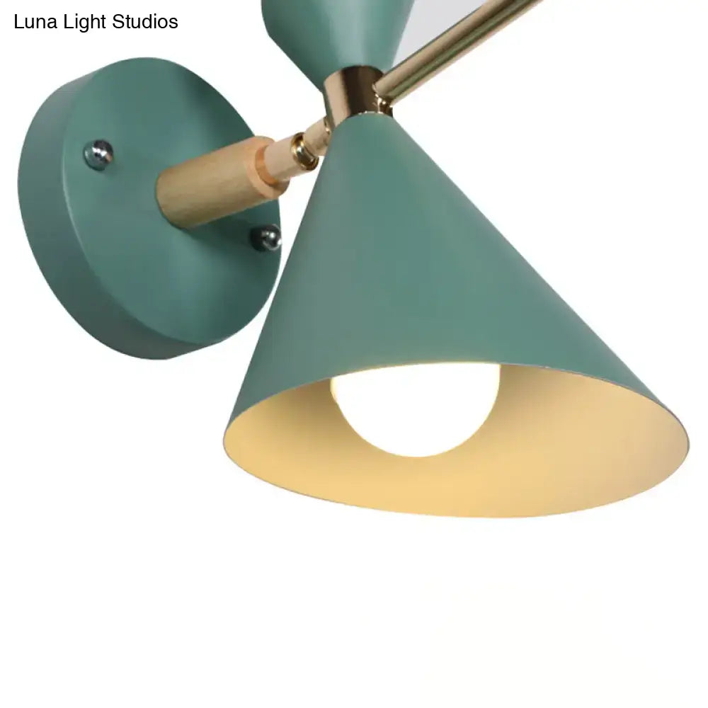 Teal conical wall sconce with brass accent and wooden joint featuring a modern black angle shade for bedroom lighting