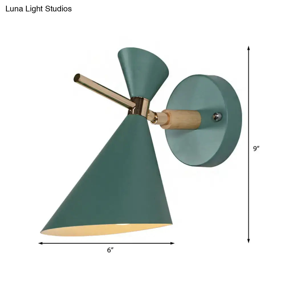 Modern teal wall sconce with brass arm wooden accent and two conical angle shades for bedroom lighting