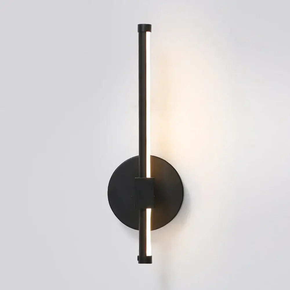 Modern black angular indoor led wall light with sleek vertical bar and circular base for bedroom decorbites indoor led use