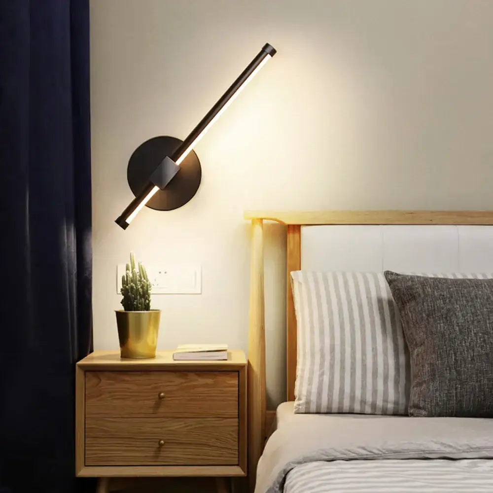 Modern black angular LED wall light with sleek design and circular base for bedroom decorbites indoor LED wall use