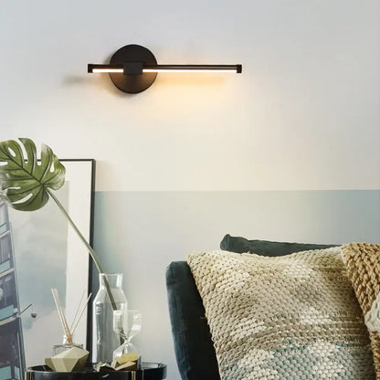 Modern black angular indoor led wall light with sleek horizontal bar and circular base for bedroom decorbites indoor led use
