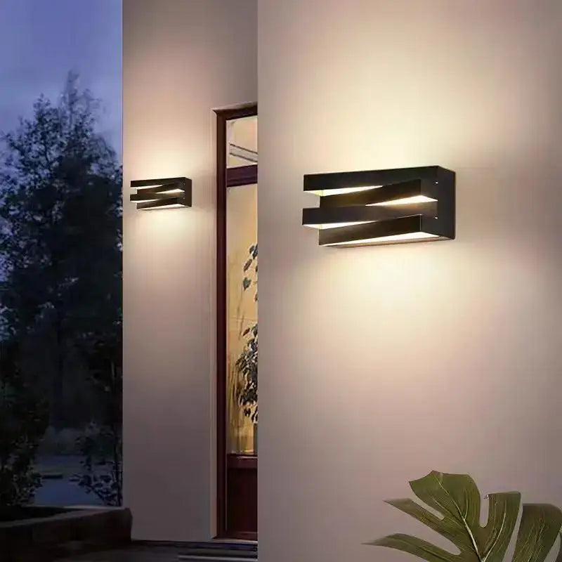 Modern black angular metal ip65 outdoor wall lamp with layered design emitting warm light for villa porch use