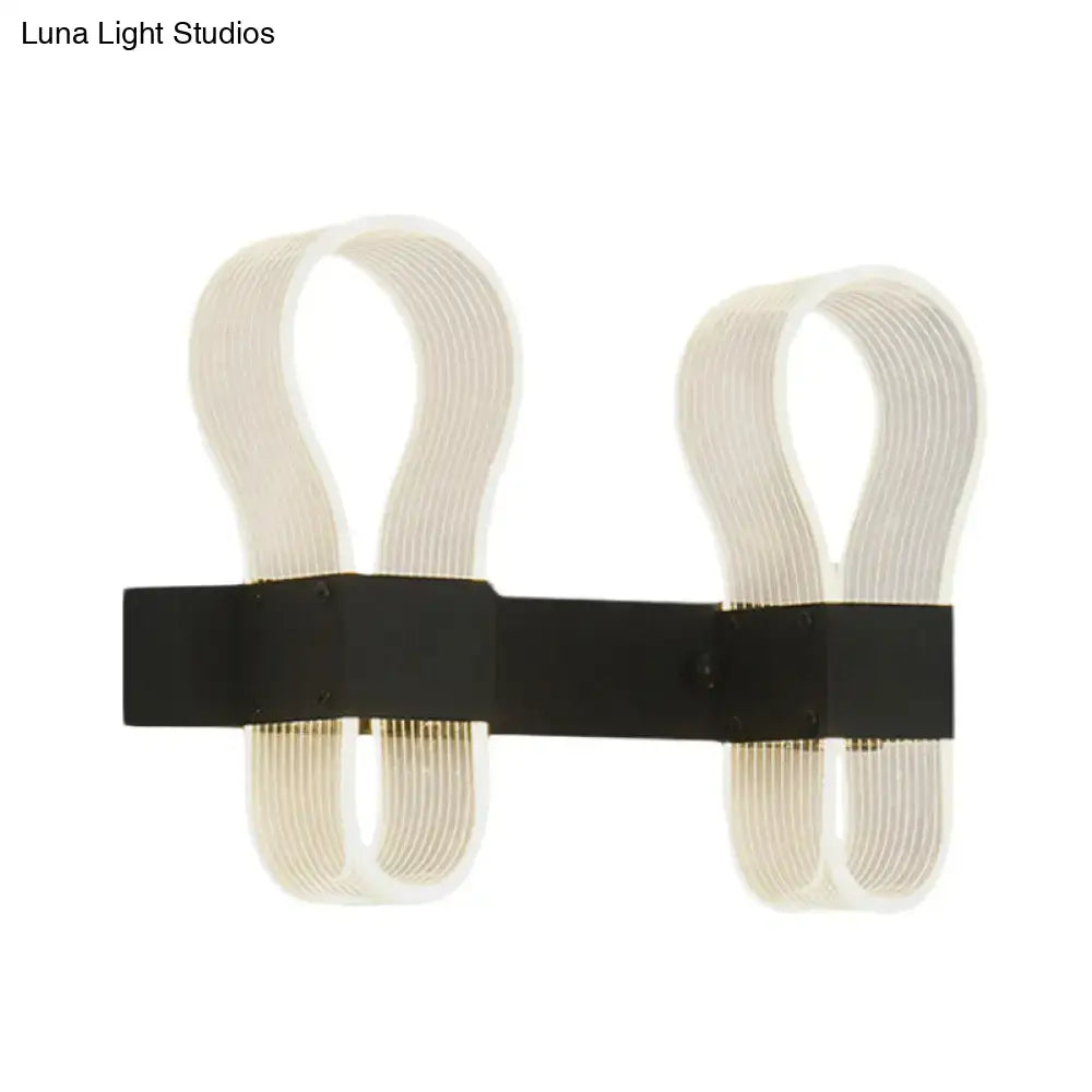 Modern black arc ring wall lamp with two curved off-white acrylic arms and a sleek black metal arc ring sconce design