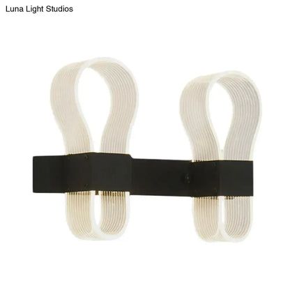 Modern black arc ring wall lamp with two curved off-white acrylic arms and a sleek black metal arc ring sconce design