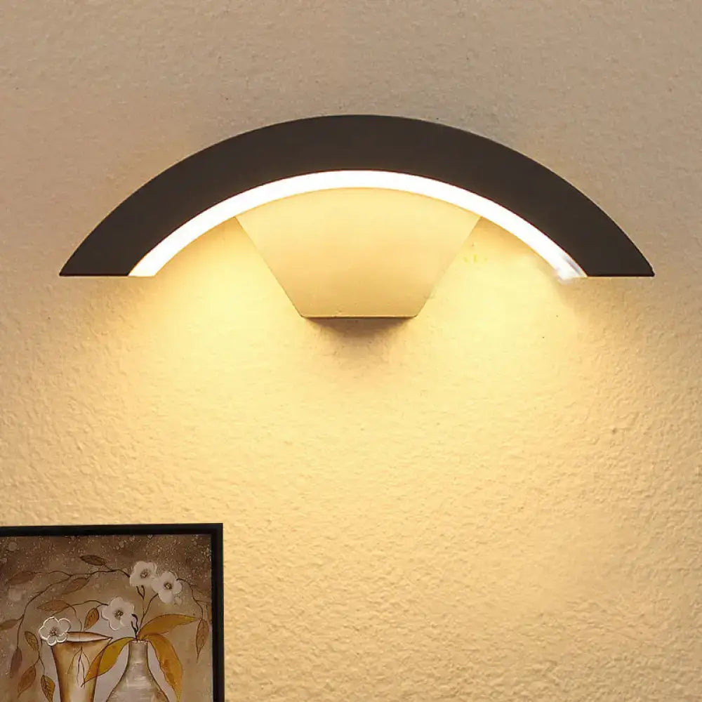 Modern black arc wall sconce with warm glowing integrated led light for bedroom wall sconce lighting