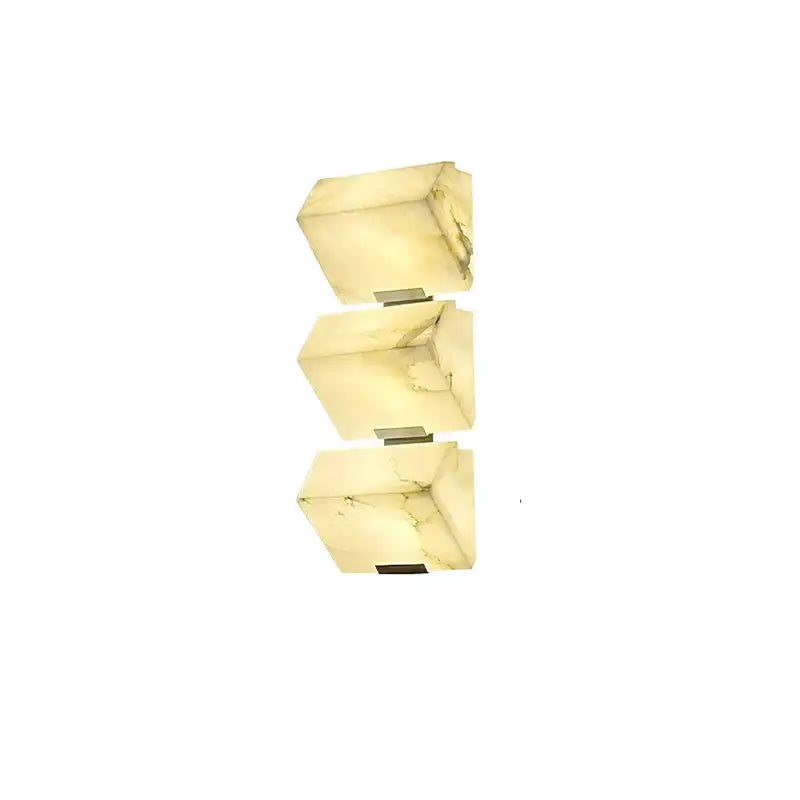 Modern black art deco marble led wall light with three stacked cream onyx sconces featuring subtle green veining