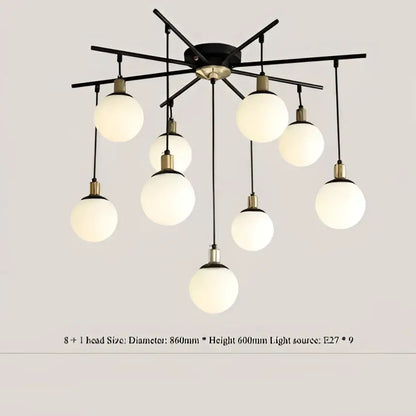 Modern black metal chandelier with nine frosted glass globes for living room decor featuring decorbites art glass ball molecule design