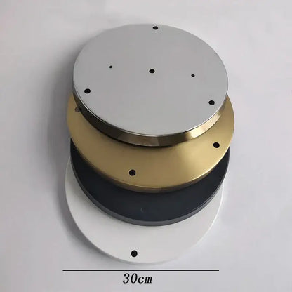 Stacked circular metal base plate lighting accessories in silver gold black and white with evenly spaced perimeter holes