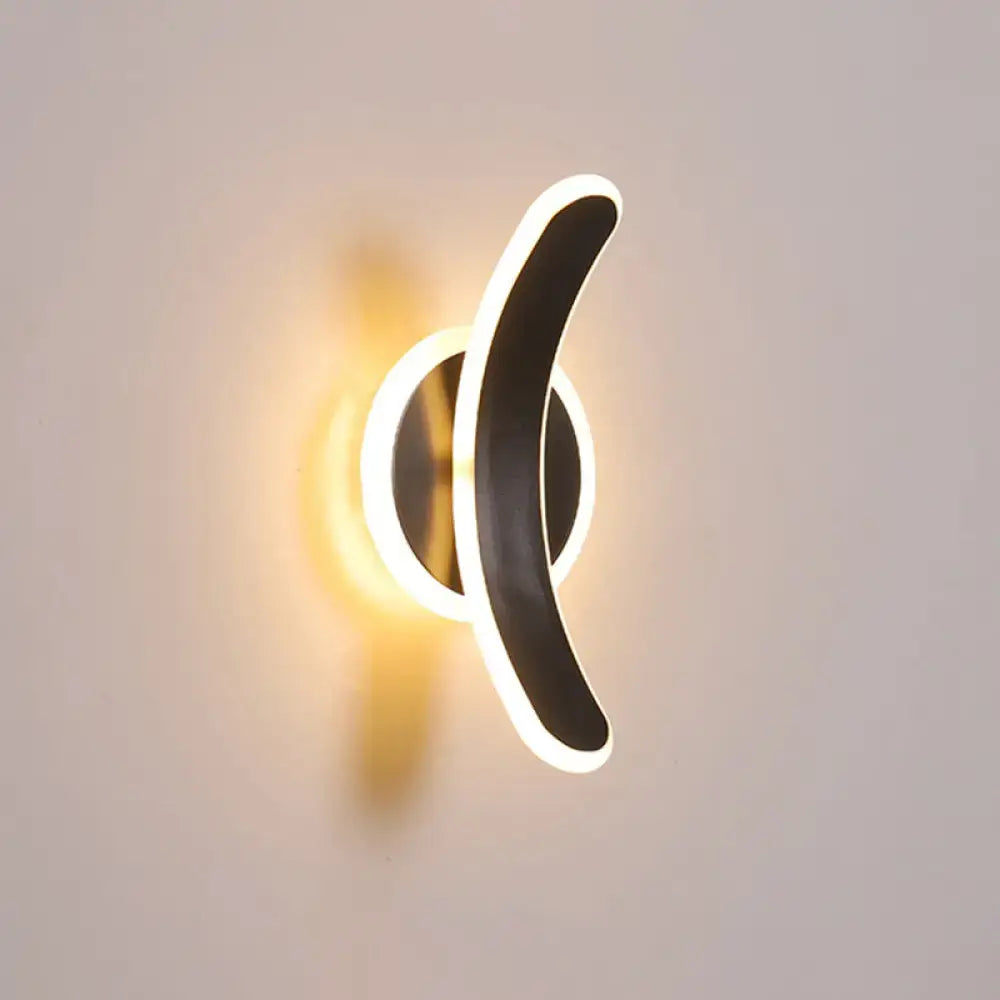 Modern black and white led wall mounted lamp with sleek curved design providing white warm light for bedroom use