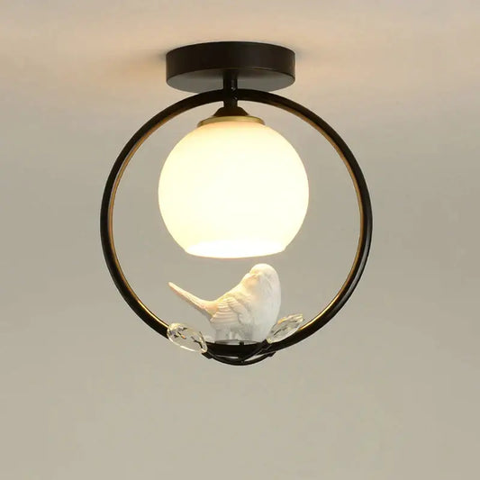 Modern black bird ceiling light fixture with ceramic bird and warm white globe for corridor entrance lighting