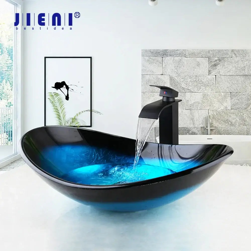 Modern black and blue glass vessel sink basin tap set with vibrant illuminated interior and matching black faucet for bathroom