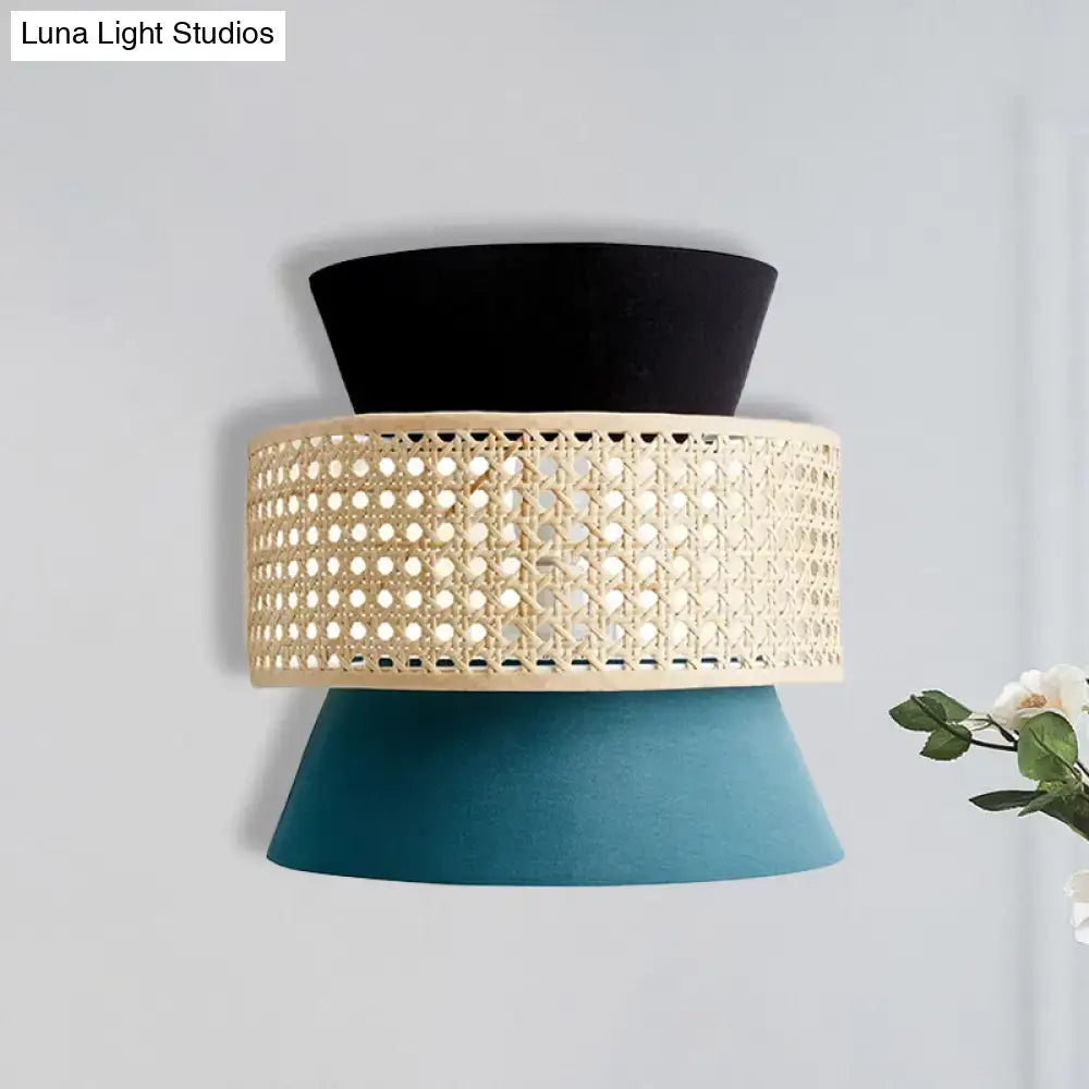 Modern black and blue rattan dual cone wall lamp with black cream woven cane band and teal fabric shades bedroom sconce