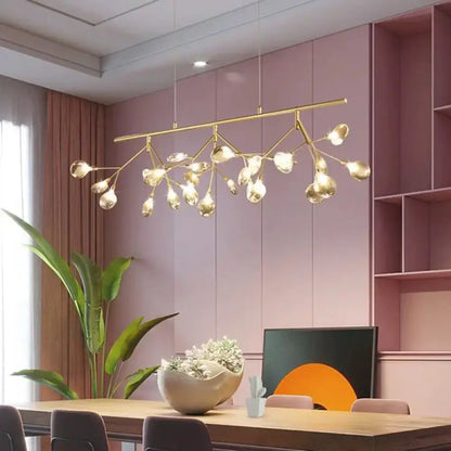 Modern gold-toned branching chandelier with clear glass globe bulbs for dining room lighting
